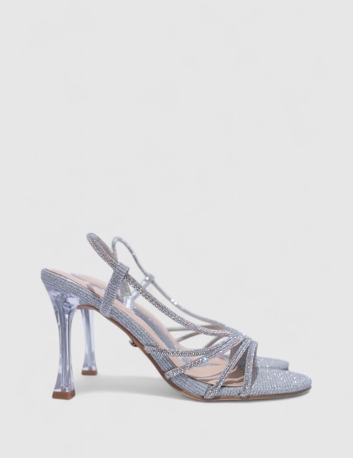 Cette image contient Talons Scintillantes avec Brides Fines chez Joliesse. à 0,00 TND en Tunisie. L'hexa de l'arrière plan est #