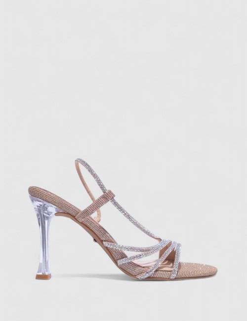 Cette image contient Talons Scintillantes avec Brides Fines chez Joliesse. à 129,99 TND en Tunisie. L'hexa de l'arrière plan est