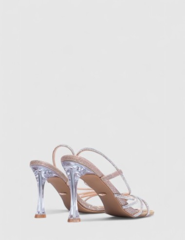 Cette image contient Talons Scintillantes avec Brides Fines chez Joliesse. à 129,99 TND en Tunisie. L'hexa de l'arrière plan est