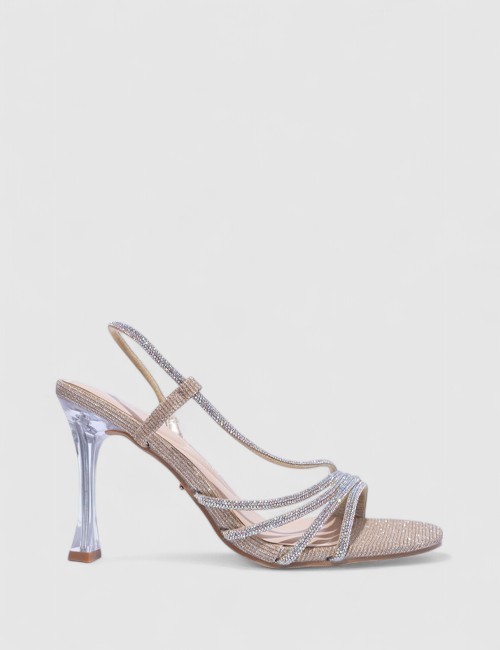 Cette image contient Talons Scintillantes avec Brides Fines chez Joliesse. à 129,99 TND en Tunisie. L'hexa de l'arrière plan est