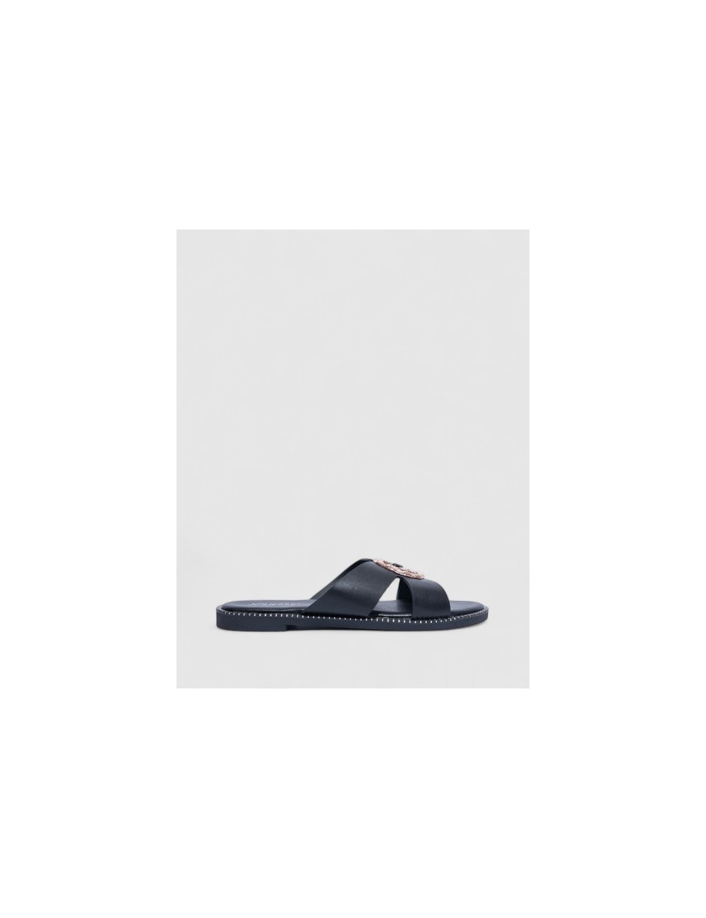Cette image contient Mules Plates en Cuir Cognac avec Ornements chez Joliesse. à 59,99 TND en Tunisie. L'hexa de l'arrière plan 