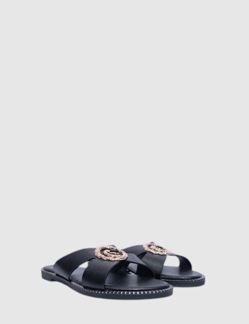 Cette image contient Mules Plates en Cuir Cognac avec Ornements chez Joliesse. à 59,99 TND en Tunisie. L'hexa de l'arrière plan 