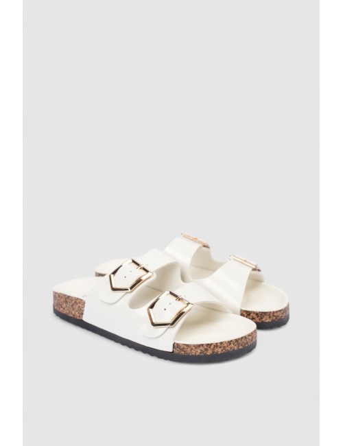 Mules à brides cloutées et...