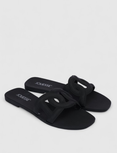 Cette image contient Mules plates noires design en silicone chez Joliesse. à 0,00 TND en Tunisie. L'hexa de l'arrière plan est #