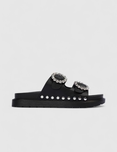 Cette image contient Mules à boucles strass et semelle épaisse chez Joliesse. à 59,49 TND en Tunisie. L'hexa de l'arrière plan e