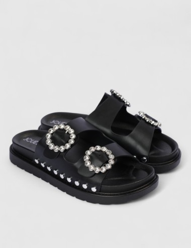 Cette image contient Mules à boucles strass et semelle épaisse chez Joliesse. à 59,49 TND en Tunisie. L'hexa de l'arrière plan e