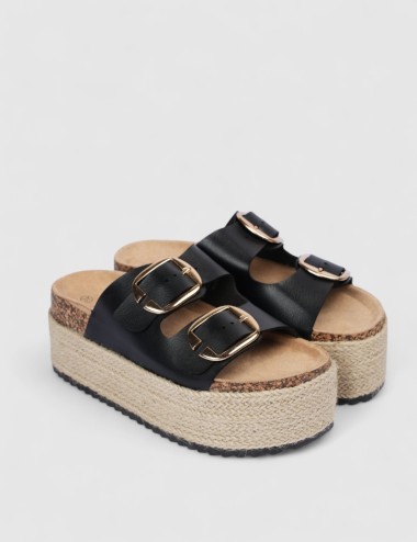 Cette image contient Mules compensées à doubles brides chez Joliesse. à 99,99 TND en Tunisie. L'hexa de l'arrière plan est #E7E7