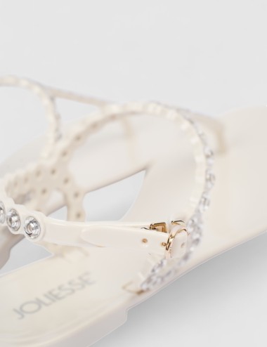 Cette image contient Nu-pieds à bijoux argentées raffinés chez Joliesse. à 89,99 TND en Tunisie. L'hexa de l'arrière plan est #E