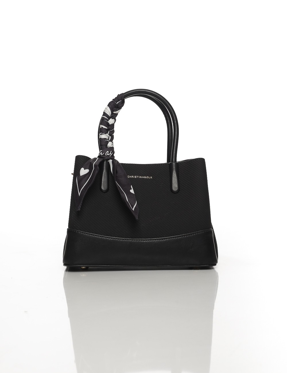 Cette image contient Sac à Main Noir avec Foulard Décoratif chez Joliesse. à 119,99 TND en Tunisie. L'hexa de l'arrière plan est