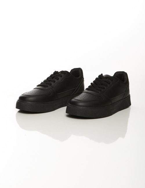 Cette image contient Baskets classiques unisexes blanches et noires chez Joliesse. à 79,99 TND en Tunisie. L'hexa de l'arrière p