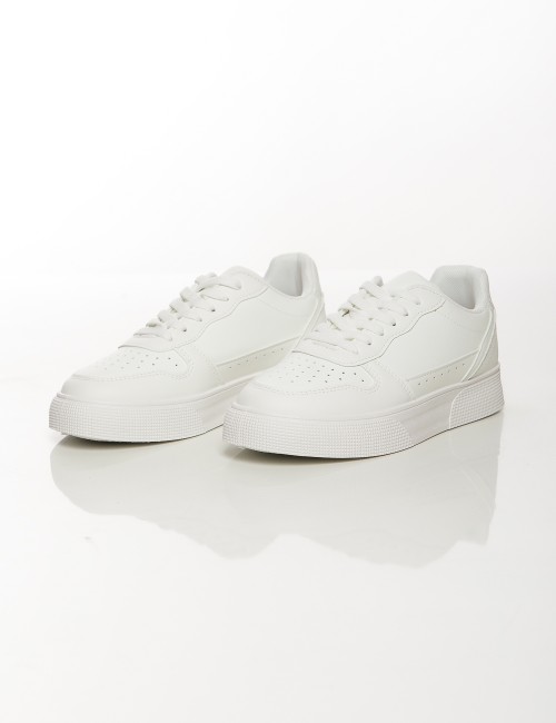 Cette image contient Baskets classiques unisexes blanches et noires chez Joliesse. à 79,99 TND en Tunisie. L'hexa de l'arrière p