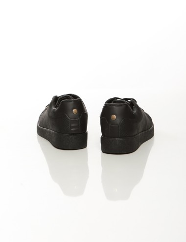 Cette image contient Baskets basses classiques, Noir et Blanc chez Joliesse. à 79,99 TND en Tunisie. L'hexa de l'arrière plan es