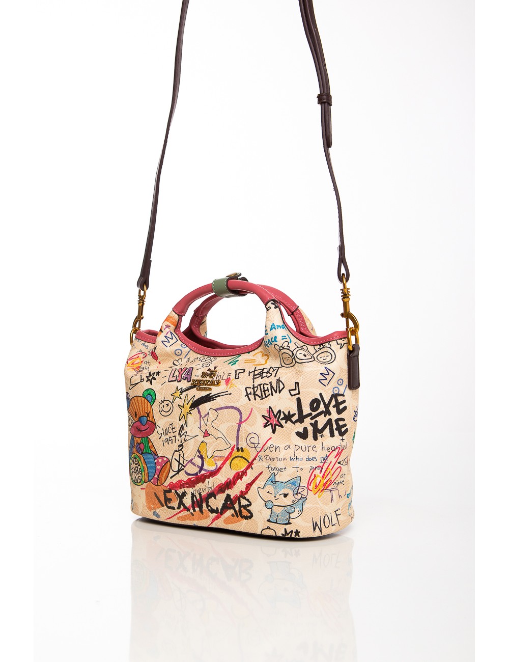 Cette image contient Sac à main multicolore avec imprimés artistiques et bandoulière amovible chez Joliesse. à 129,99 TND en Tun