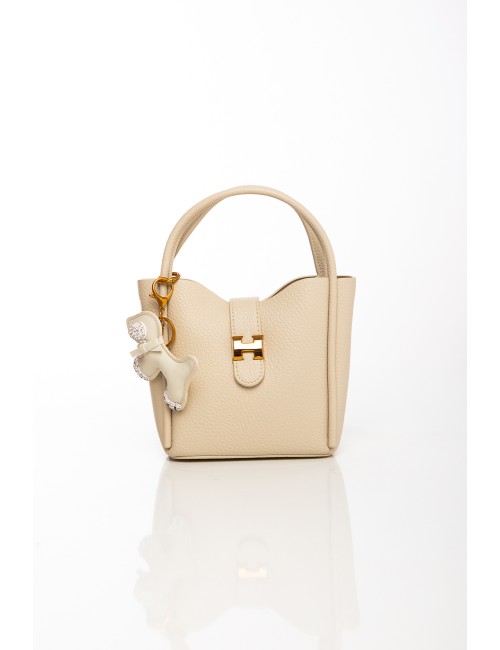 Cette image contient Sac à main beige avec porte-clés chien décoratif et bandoulière chez Joliesse. à 109,99 TND en Tunisie. L'h