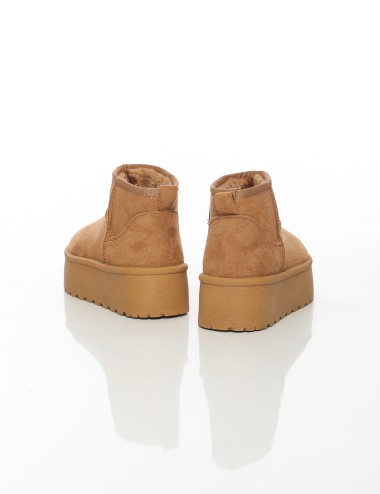 Cette image contient Bottines fourrées femme à semelle épaisse chez Joliesse. à 79,99 TND en Tunisie. L'hexa de l'arrière plan e