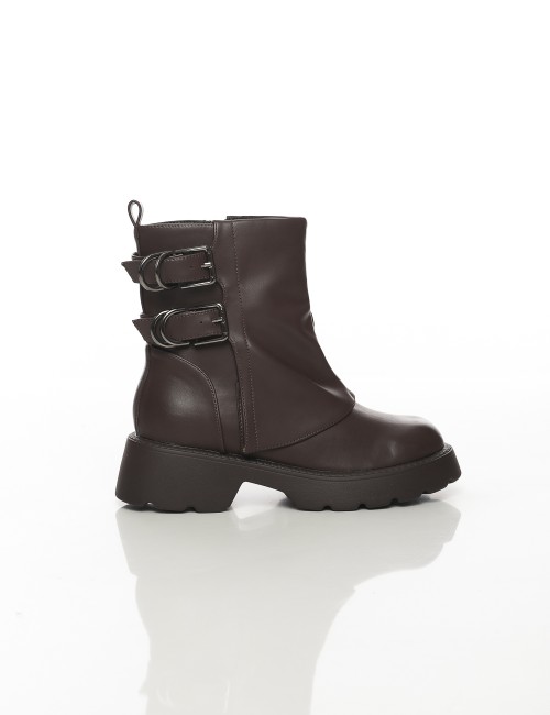 Cette image contient Bottines à semelle épaisse avec doubles boucles métalliques chez Joliesse. à 159,99 TND en Tunisie. L'hexa 