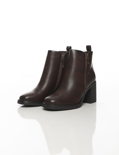 Cette image contient Bottines à talon carré avec fermeture zippée chez Joliesse. à 169,99 TND en Tunisie. L'hexa de l'arrière pl