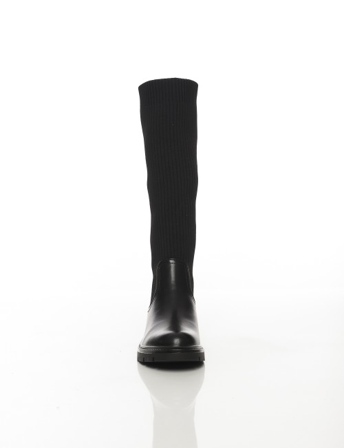 Cette image contient Bottes hautes noires avec tige en tissu côtelé chez Joliesse. à 169,99 TND en Tunisie. L'hexa de l'arrière 