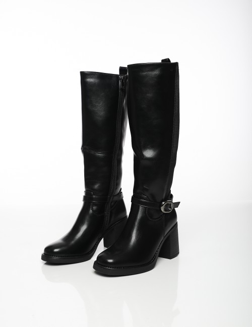 Cette image contient Bottes à Talons avec Boucle Latérale chez Joliesse. à 189,99 TND en Tunisie. L'hexa de l'arrière plan est #