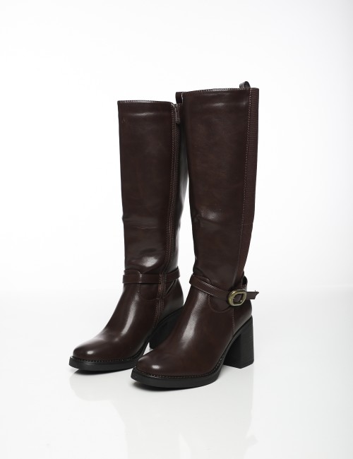 Cette image contient Bottes à Talons avec Boucle Latérale chez Joliesse. à 189,99 TND en Tunisie. L'hexa de l'arrière plan est #