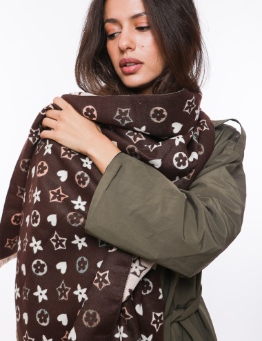 Cette image contient Écharpe pour femme imprimé chez Joliesse. à 64,99 TND en Tunisie. L'hexa de l'arrière plan est #E7E7E7