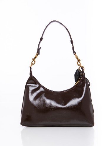 Cette image contient Sac à Main Chocolat Verni et noir chez Joliesse. à 149,99 TND en Tunisie. L'hexa de l'arrière plan est #E7E