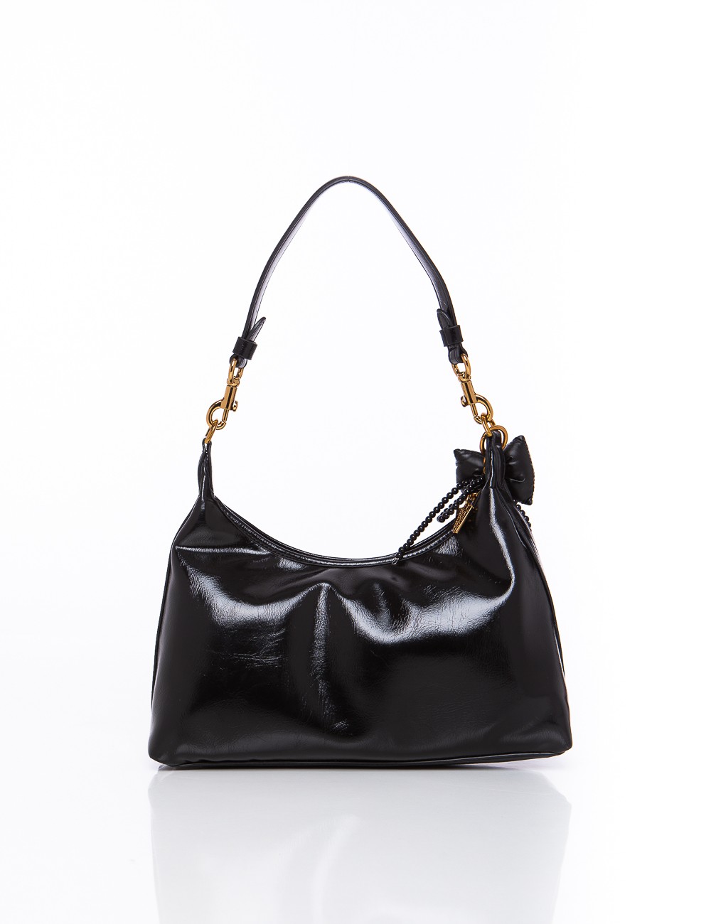 Cette image contient Sac à Main Chocolat Verni et noir chez Joliesse. à 149,99 TND en Tunisie. L'hexa de l'arrière plan est #E7E