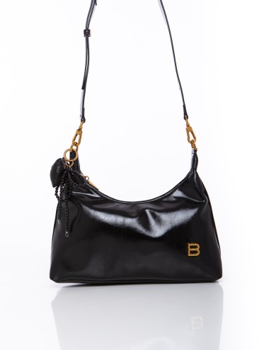 Cette image contient Sac à Main Chocolat Verni et noir chez Joliesse. à 149,99 TND en Tunisie. L'hexa de l'arrière plan est #E7E