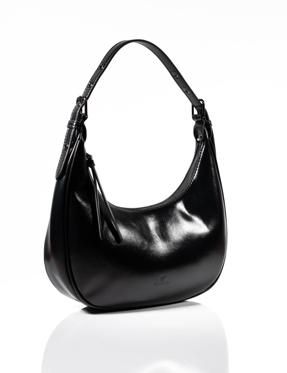 Cette image contient Sac à Main Demi-Lune chez Joliesse. à 129,99 TND en Tunisie. L'hexa de l'arrière plan est #E7E7E7